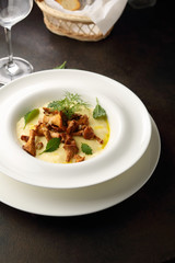 Polenta with fried mushrooms chanterelles