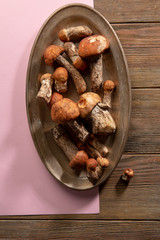 Wild fresh boletus mushrooms on platter
