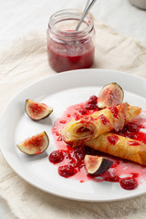 Breakfast crepes with berry jam