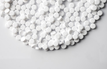 White pills isolated on white background, conceptual image