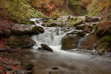 Naklejka na ściany i meble Mountain stream in autumn