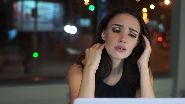 Woman Manager, tired of working at the laptop, headache.