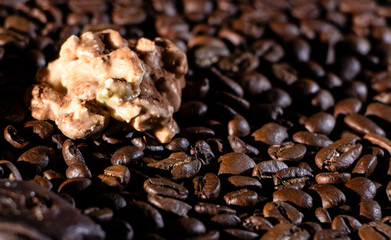 Chocolate pieces and coffee beans close up
