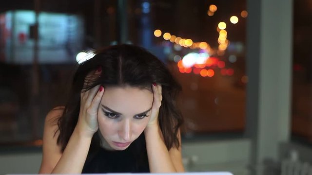 Woman Manager, tired of working at the laptop, headache.