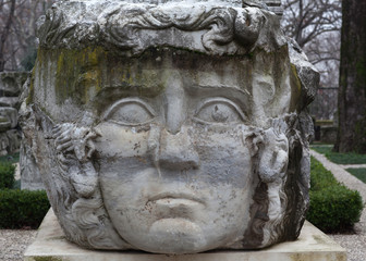 Obraz premium Column with Medusa Gorgon head in a park in Istanbul, Turkey