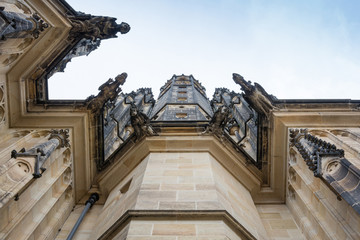 The Cathedral of Saint Vitus (1344) in Prague, Czech Republic, architectural detail, with scary gargoyles protecting the tower 