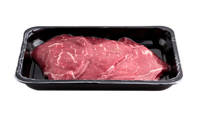 Vacuum-packed beef on a white background. Marbled beef from the store isolated on a white...