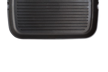 Grill pan isolated on white background. New grill pan closeup on a white background.