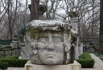 Column with Medusa Gorgon head in public park in Istanbul, Turkey