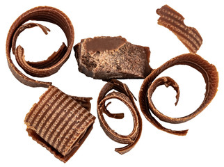 hocolate shavings and chocolate pieces isolated on white background from top view