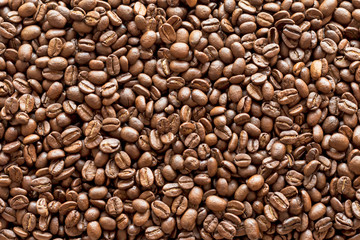 Texture of coffee beans. Top view of coffee beans background