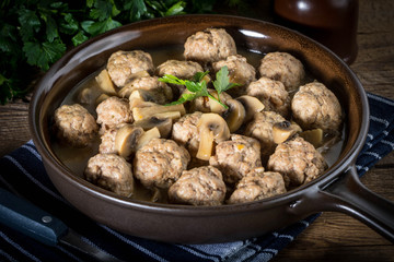 Delicious homemade swedish meatballs with mushroom cream sauce. Small depth of field.