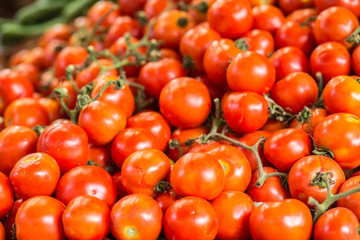 Pile of red juicy tomatoes background.