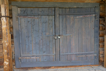 Abandoned barn vintage wooden door. Old photo of rustic house entrance