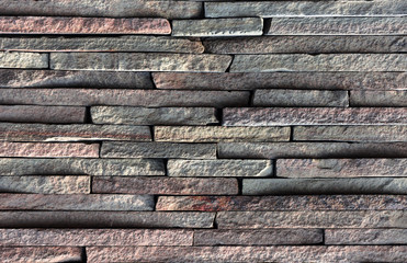 Dry old stone wall texture background close up