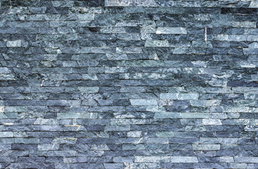 Dry old stone wall texture background close up