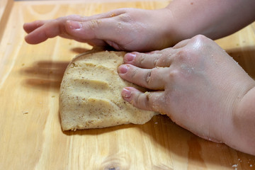 Fototapeta na wymiar Knead dough with hands