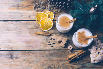 Eggnog (egg-nog), traditional Christmas winter drink with cinnamon, cloves and nutmeg. Homemade drinks. Winter Christmas mood. Copy space.