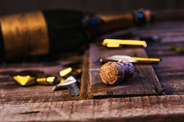 Champagne Cork on wood with bottle