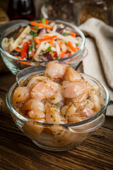 Raw chicken fillet breast cut into pieces.