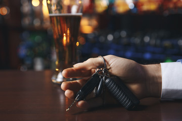 Do not drink and drive! Cropped image of drunk man talking car keys