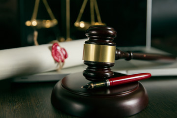 Last will and testament with wooden judge gavel document is mock-up not rea