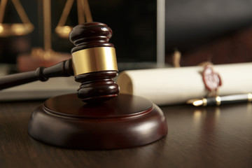 Last will and testament with wooden judge gavel document is mock-up not rea