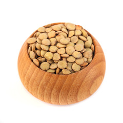 dry lentils on wooden bowl isolated on a white background