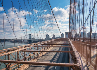 Architecture of the famous Brooklyn Bridge and view of the skyscrapers of New York, a Christmas morning 