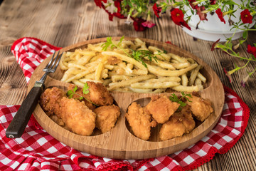 Chicken nuggets with yellow beans.