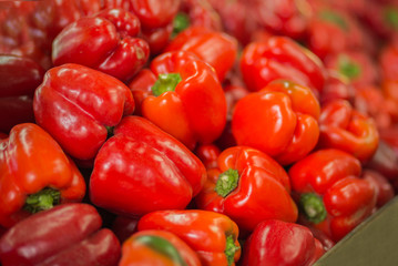 Pile of red bell peppers background.