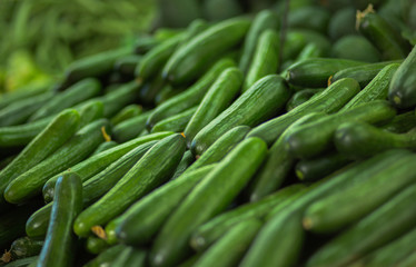 Pile of cucumbers background.