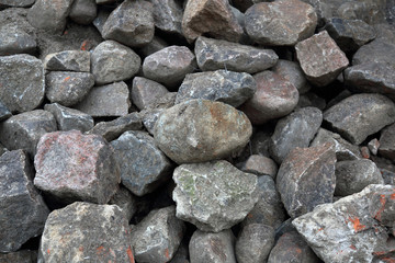 Fototapeta na wymiar Original textured surface of of a natural coarse stone