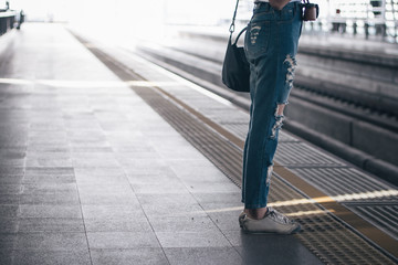 Business woman in subway using smartphone,Woman working on smart phone while traveling by train.