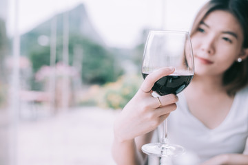 Outdoors portrait of a beautiful wine tasting tourist woman.Young Woman drinking wine in  Italian...