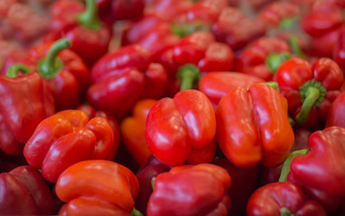 Pile of red bell peppers background.