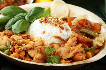 various street food with chicken wings on rustic background. balinese nasi campur and indian and...