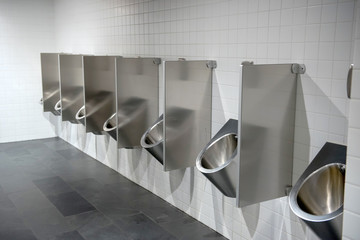 Public men's toilet. Everything is made of metal