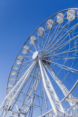 Obraz premium Modern giant ferris wheel on the shores of the river, Krakow, Poland, May 2018.