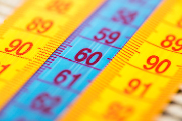 Three measuring tapes showing 90-60-90 as ideal parameters for women. The concept of an ideal...