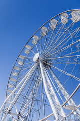 Modern giant ferris wheel on the shores of the river, Krakow, Poland, May 2018.