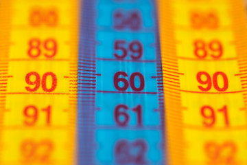 Three measuring tapes showing 90-60-90 as ideal parameters for women. The concept of an ideal...