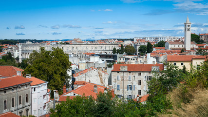 Panoramic view of Pula with ancient Roman Amphitheater and church tower, Istria region, Croatia