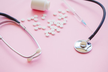 Close up of pills. Dietary supplements. Variety pills. Vitamin capsules on pink background