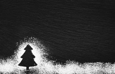 silhouette of a Christmas tree drawn with white flour