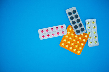 Medical Pills. Colored Pills And Capsule On Blue Background. Pharmacy Theme, Capsule Pills With...