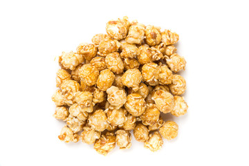 Handfuls of caramel popped popcorn kernels