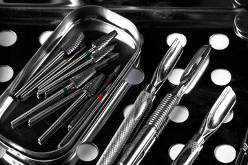 Professional manicure tools. Closeup Of Nail Care Tools. set of metallic manicure tools macro...
