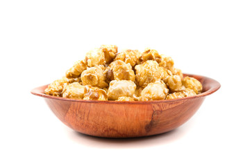Fototapeta na wymiar Handfuls of caramel popped popcorn kernels