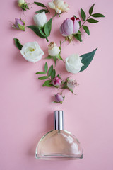 Flower arrangement. Flowers, fragrance, perfume on pink background.